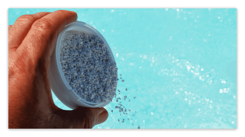 Adding pool shock granules to pool water