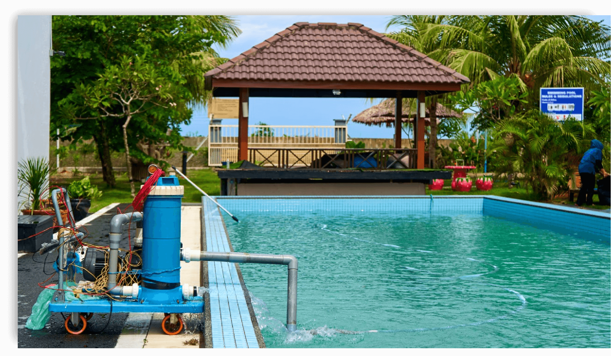 Swimming pool being drained with pump and hoses - How to Drain a Pool Safely
