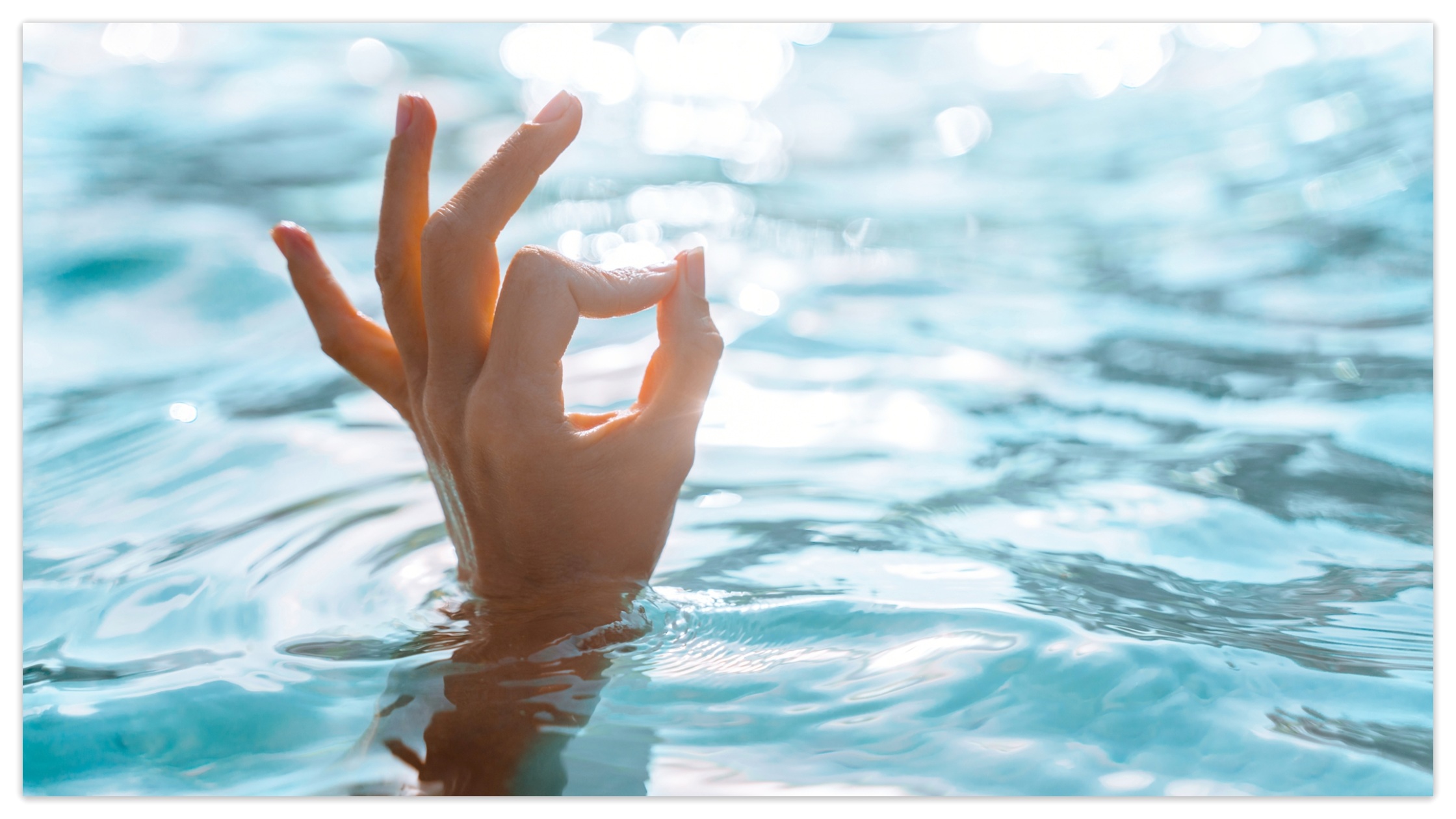 A hand makes sign OK showing soft water.