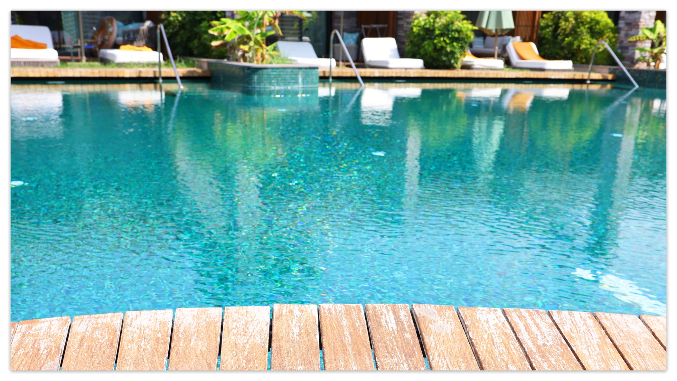 A swimming pool with a relaxing and convenient deck.