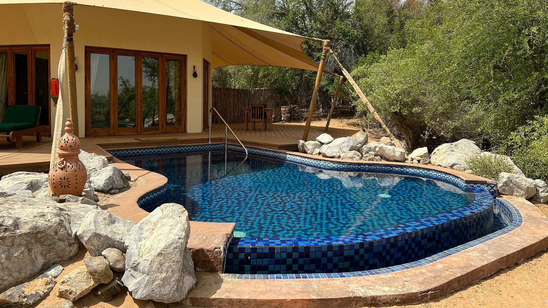 Rock piles add privacy to the pool
