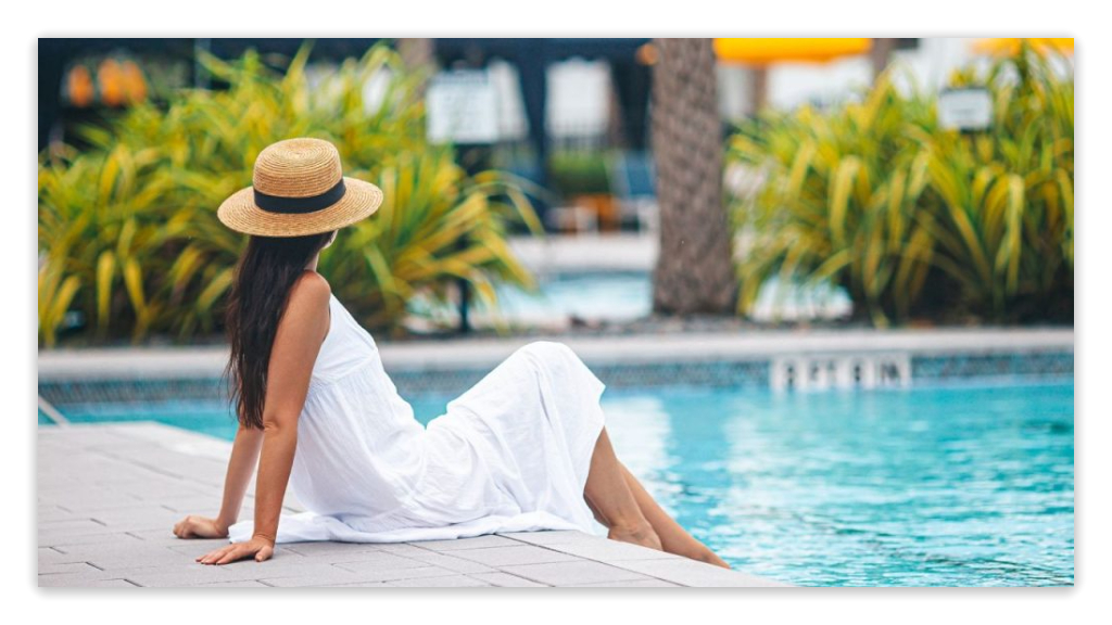 Woman relaxing by a clean, chemical-free pool