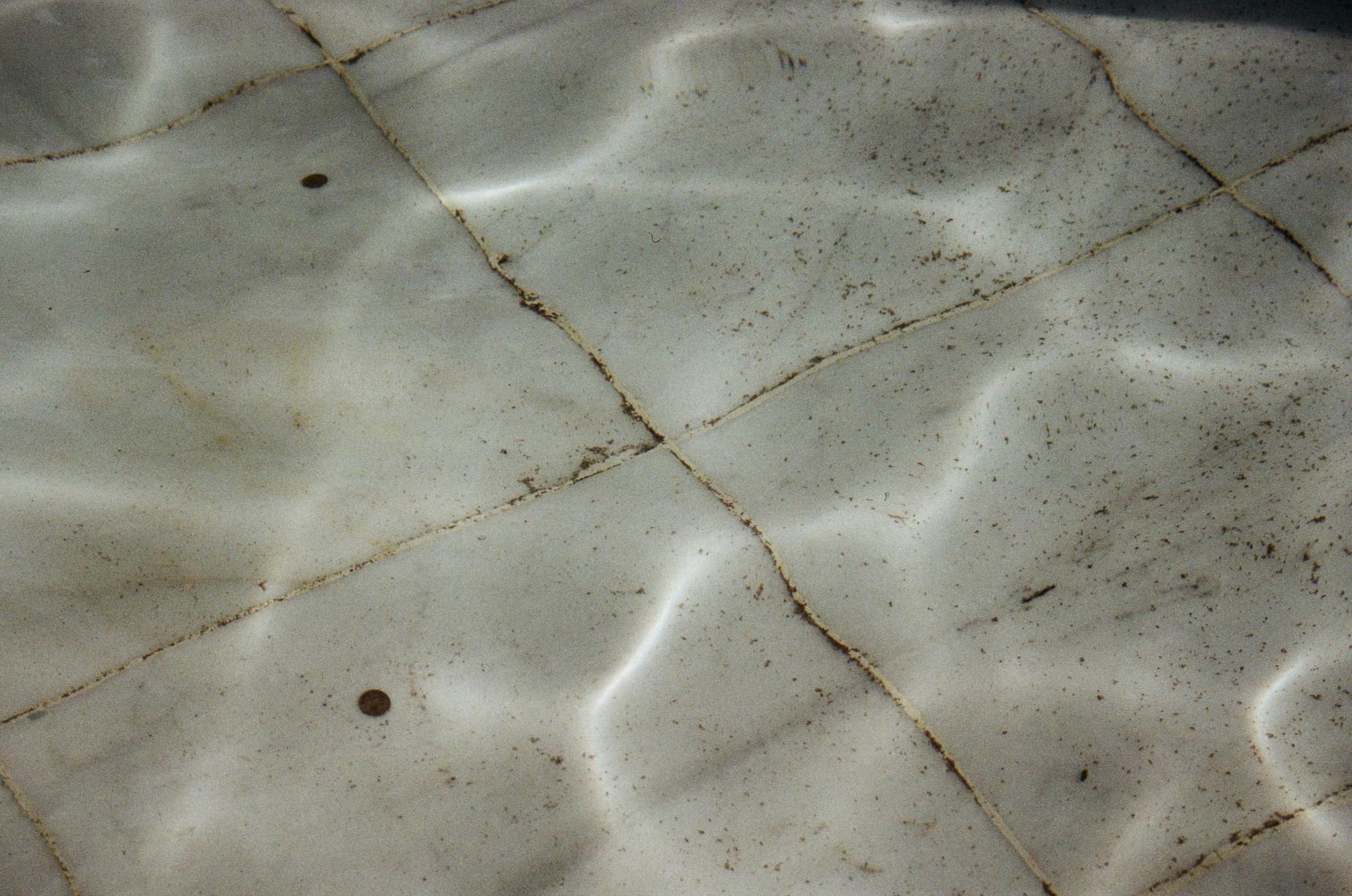 Dirty pool tile floor